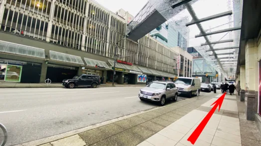 Sidewalk to the right of the street-level exit
