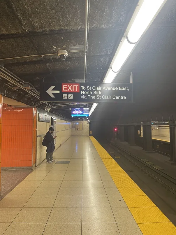 Platform sign reading EXIT To St Clair Avenue East, North Side