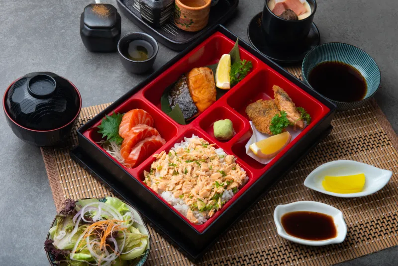 Japanese bento box with teriyaki salmon and tempura